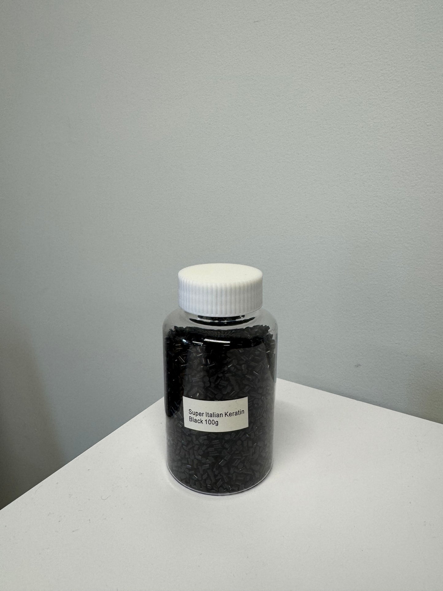 Black keratin beads